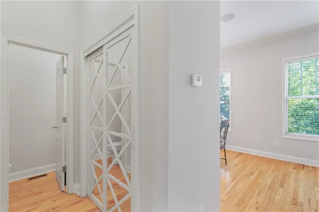 a bathroom with a window and a shower