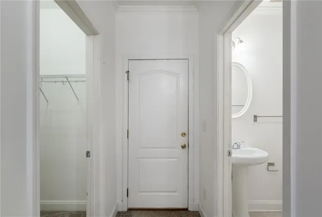 a bathroom with a glass shower door