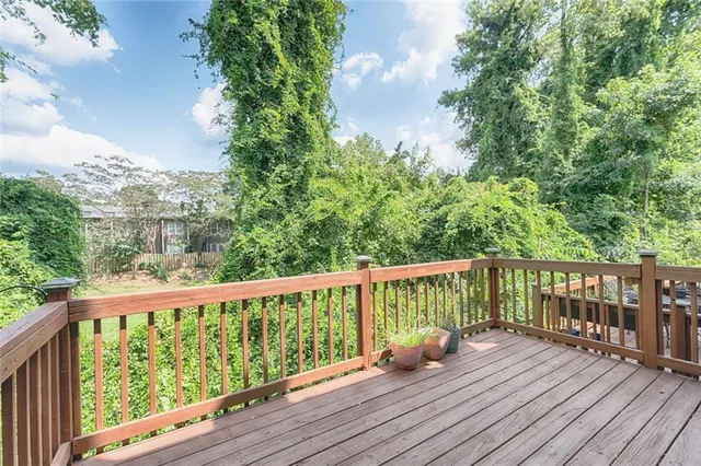 a view of balcony with wooden floor