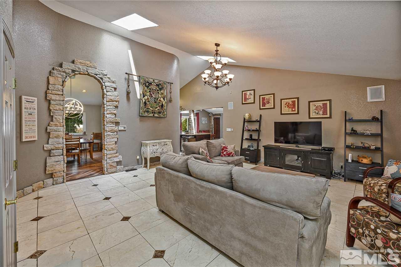 13040 Valley Springs Road Reno, NV 89511 - Photo 13 of 39 a living room with furniture and a flat screen tv