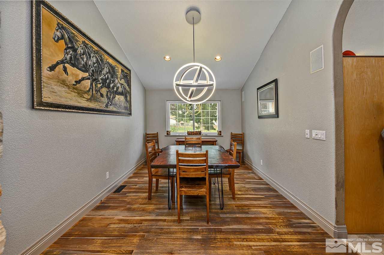 13040 Valley Springs Road Reno, NV 89511 - Photo 20 of 39 a view of a dining room with furniture window and wooden floor