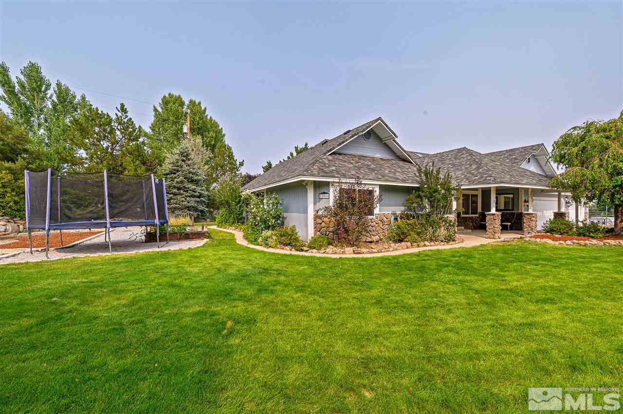 13040 Valley Springs Road Reno, NV 89511 - Photo 2 of 39 a view of a house with a yard and sitting area
