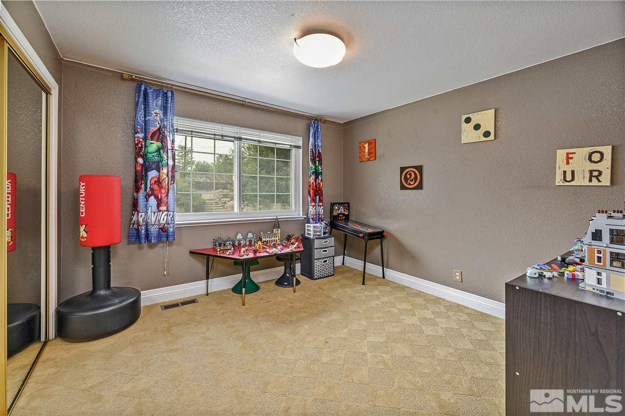 13040 Valley Springs Road Reno, NV 89511 - Photo 25 of 39 a living room with furniture and a window