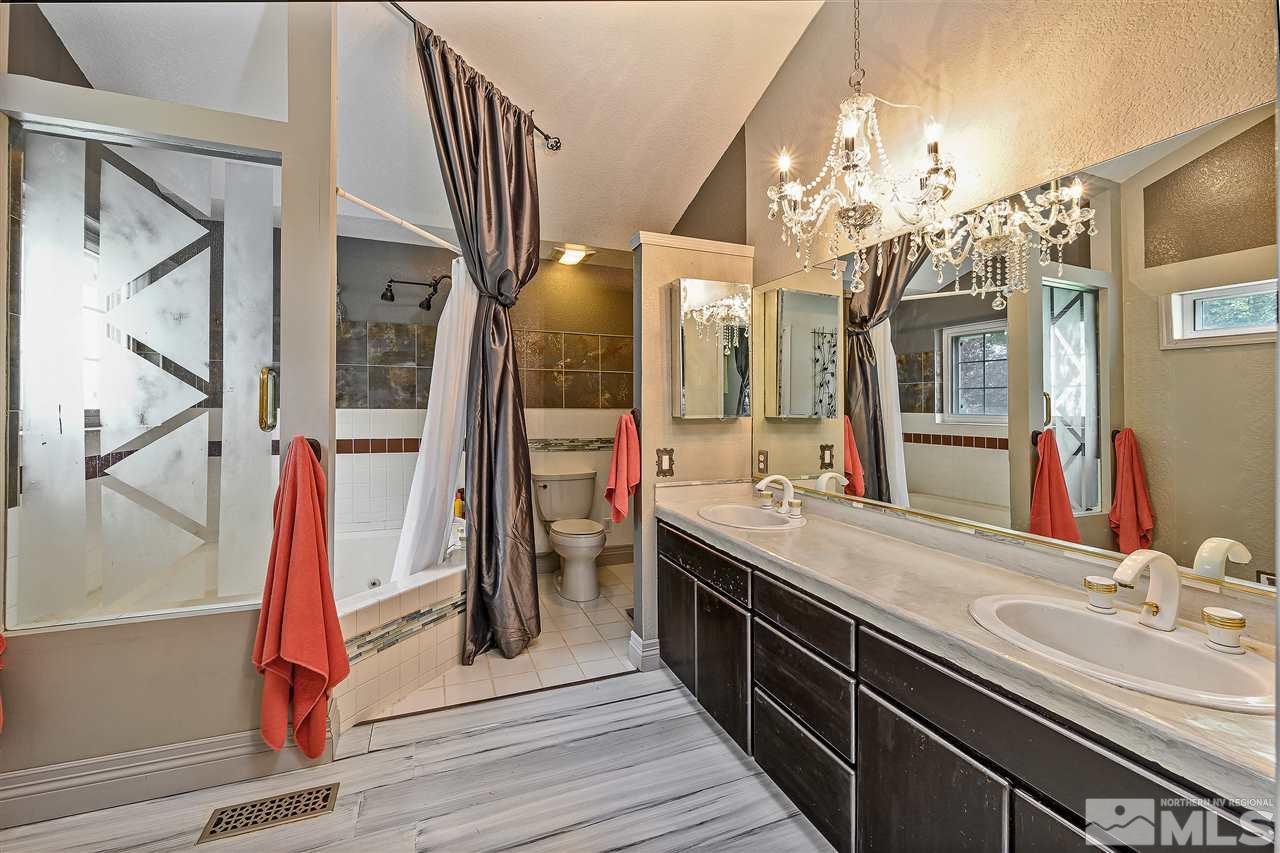13040 Valley Springs Road Reno, NV 89511 - Photo 30 of 39 a bathroom with a sink and a mirror