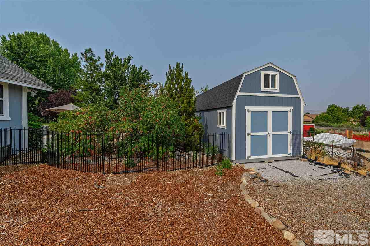 13040 Valley Springs Road Reno, NV 89511 - Photo 35 of 39 a front view of a house with a yard