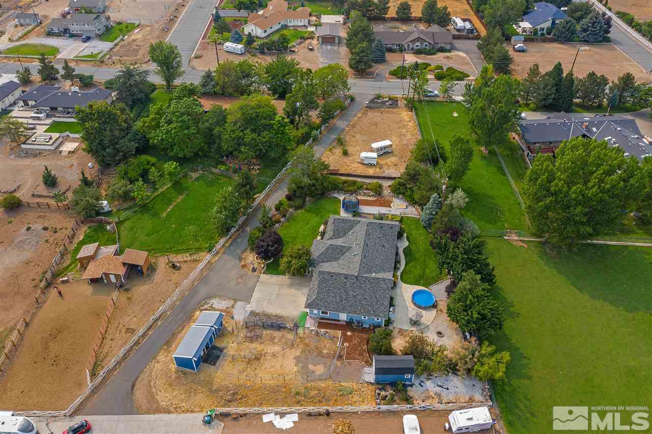 13040 Valley Springs Road Reno, NV 89511 - Photo 7 of 39 an aerial view of a house with outdoor space lake and trees all around