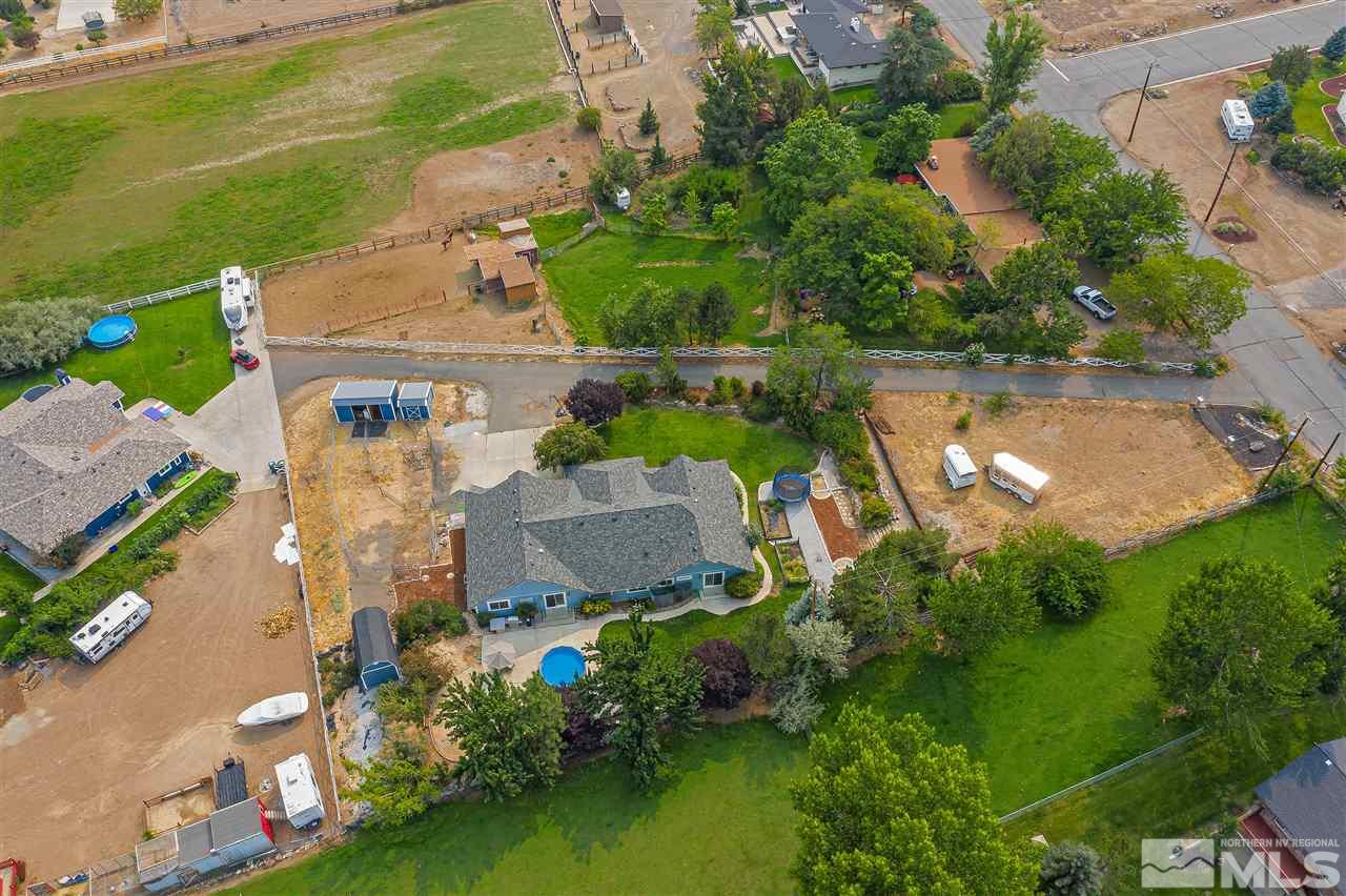 13040 Valley Springs Road Reno, NV 89511 - Photo 8 of 39 an aerial view of a house with a garden and lake view