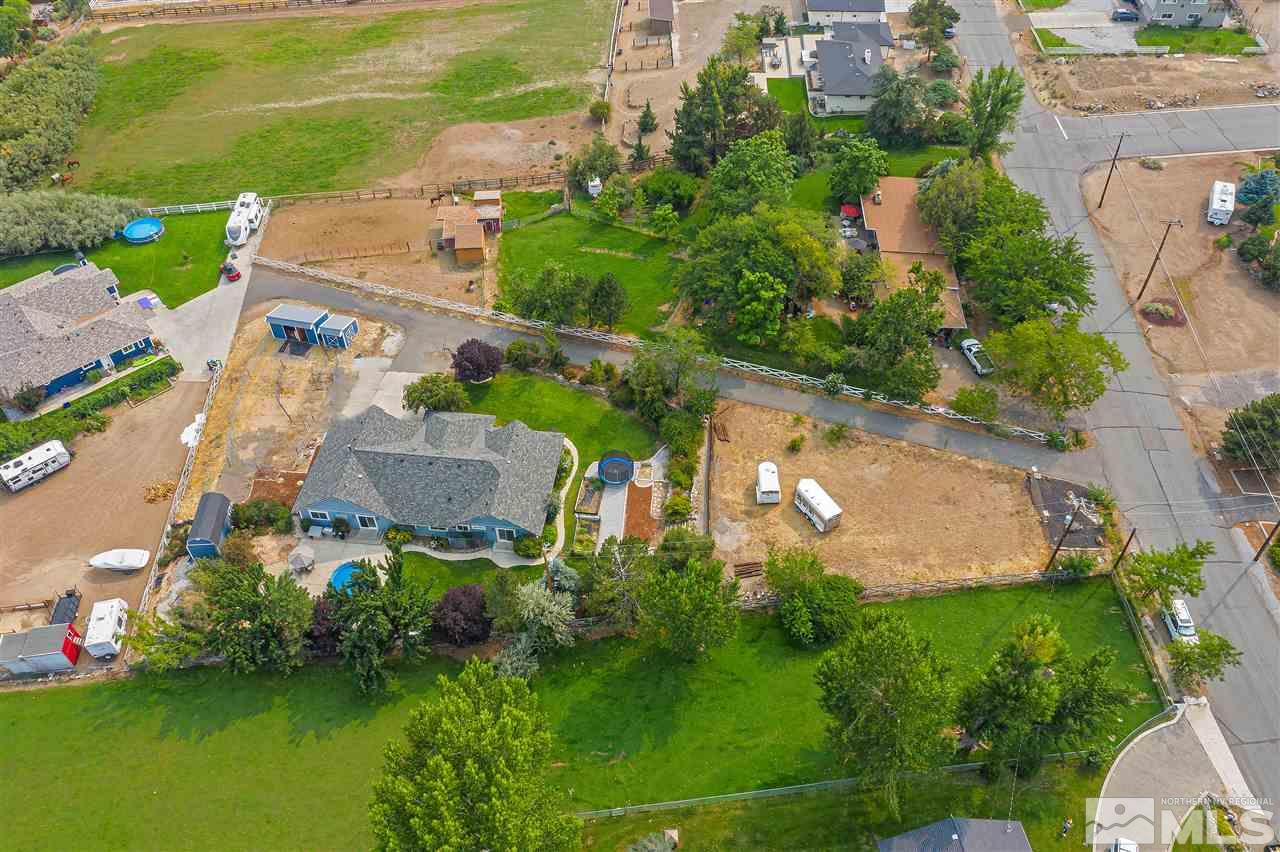 13040 Valley Springs Road Reno, NV 89511 - Photo 9 of 39 an aerial view of a house with a garden and lake view