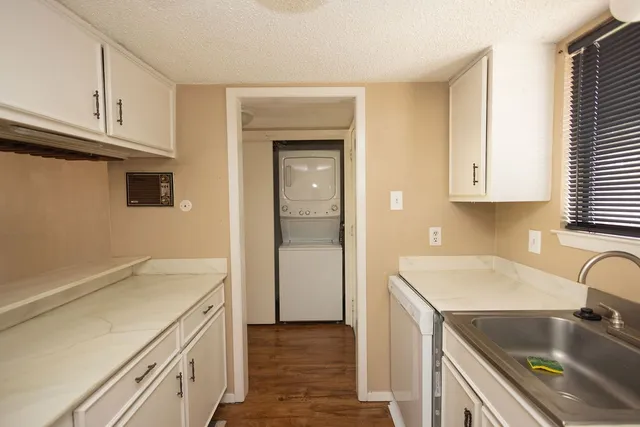 a kitchen that has a sink and a stove