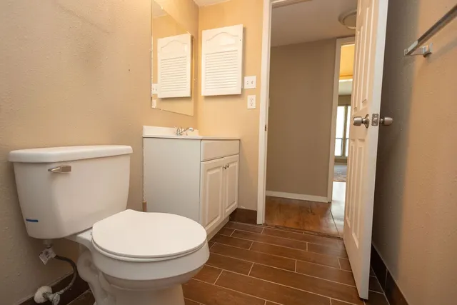 a bathroom with a toilet and a shower