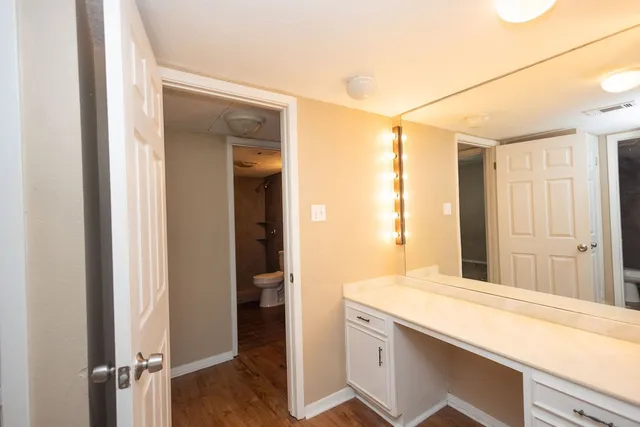 a room with a sink and a mirror