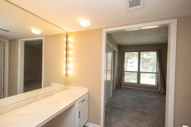 a room with a bed and a window