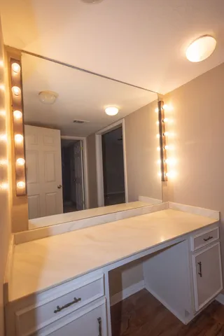 a bathroom with a sink and a mirror