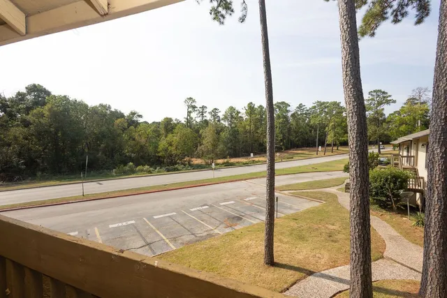 a view of a city from a floor to ceiling window