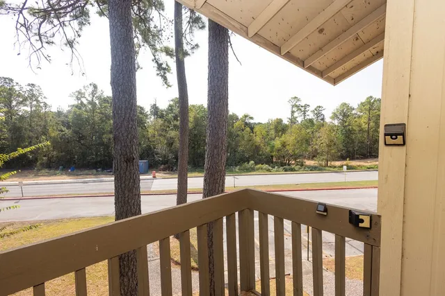a view of a street view from a balcony