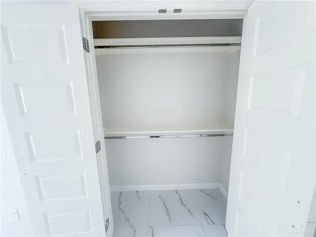 a view of an empty walk in closet