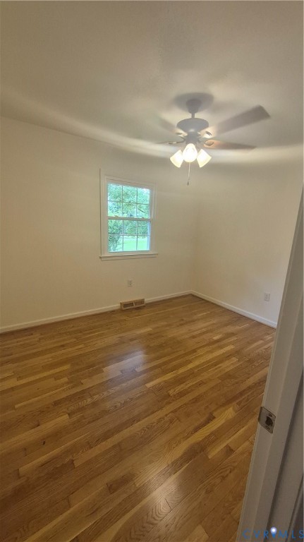 7818 River Road Petersburg, VA 23803 - Photo 7 of 19 Room featuring wood-finish flooring, a white trim