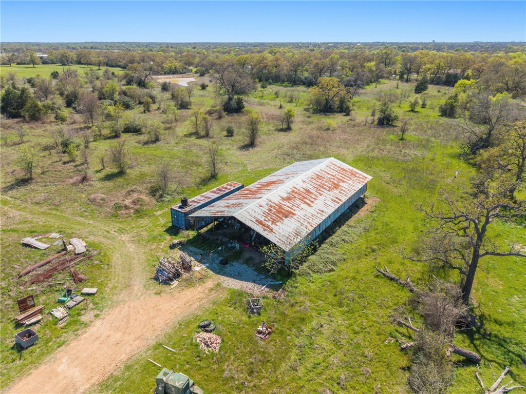 8560 Grassbur Road Bryan, TX 77808 - Photo 12 of 16 an aerial view of a house with a yard