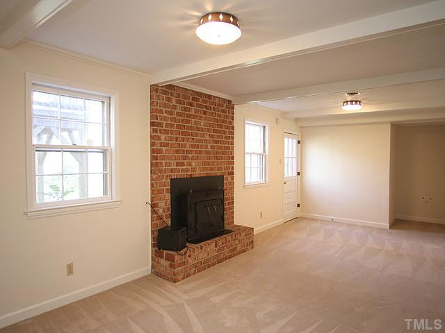 4512 Connell Drive Raleigh, NC 27612 - Photo 14 of 25 Wood stove in 2nd fireplace in lower level. Plumbed for wet bar. Den/Family/Great Room