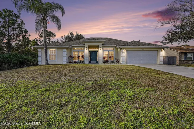 front view of a house with a yard