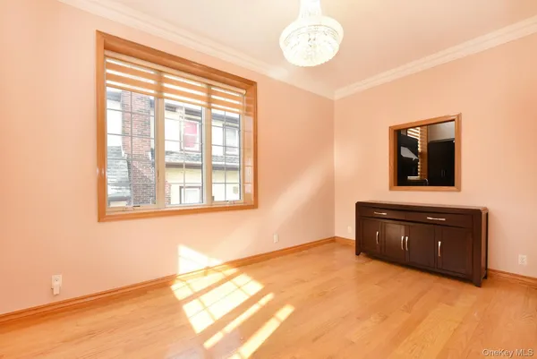 a room with a bed and a dresser