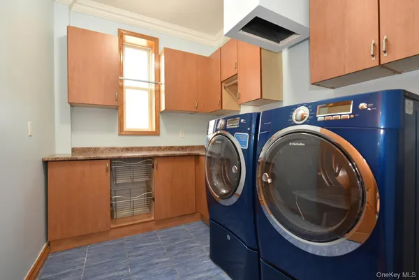 a bathroom with a sink a washer and dryer