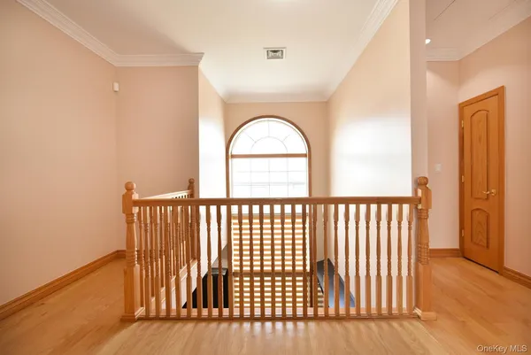 a view of a room with wooden floor