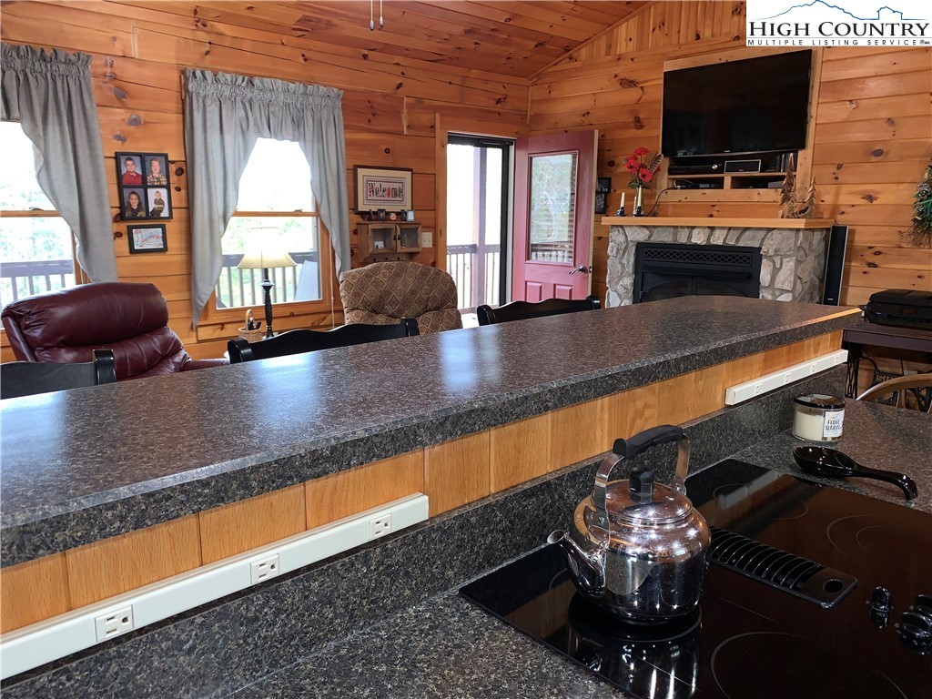 447 South Turkey Ridge Crumpler, NC 28617 - Photo 13 of 39 a living room with furniture and a flat screen tv