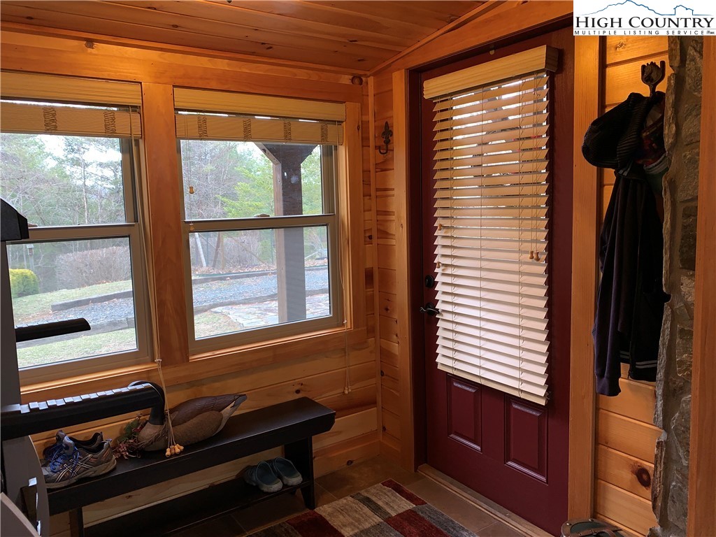 447 South Turkey Ridge Crumpler, NC 28617 - Photo 25 of 39 a blue bench sitting in front of a window