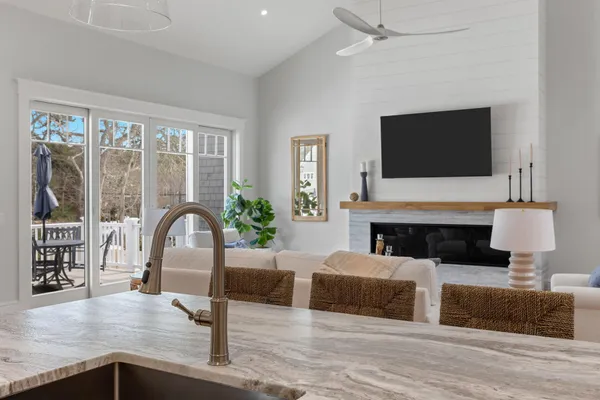 a bathroom with a granite countertop sink mirror and vanity