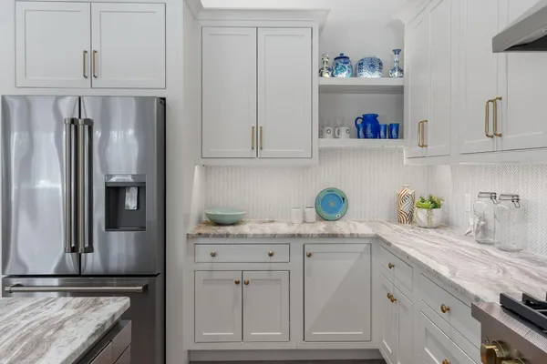 a bathroom with double sink and a mirror