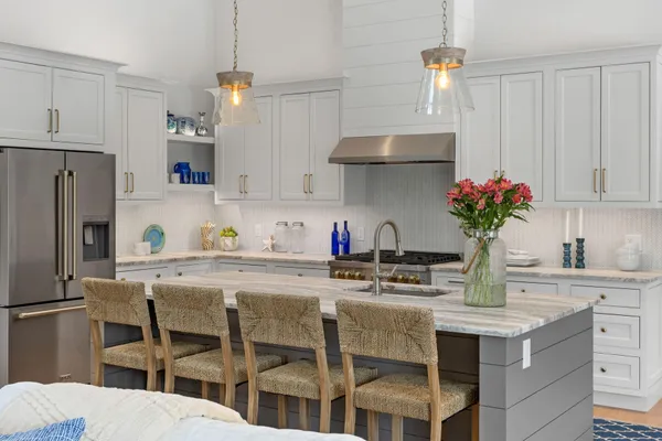 a bathroom with a granite countertop toilet a sink and mirror