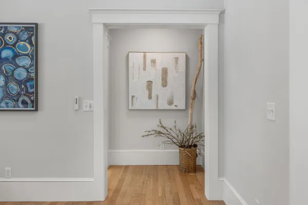 a bedroom with a bed and a couch with window