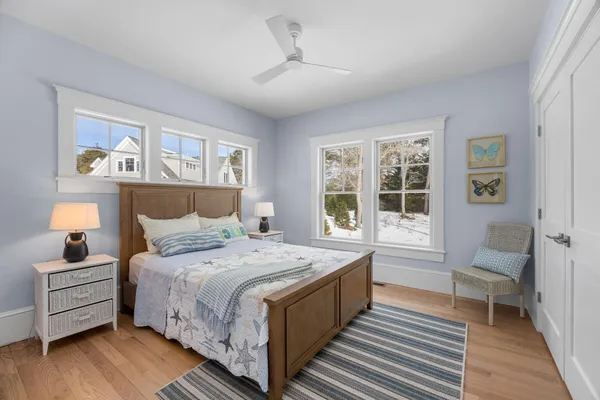 a bathroom with a granite countertop toilet sink and mirror