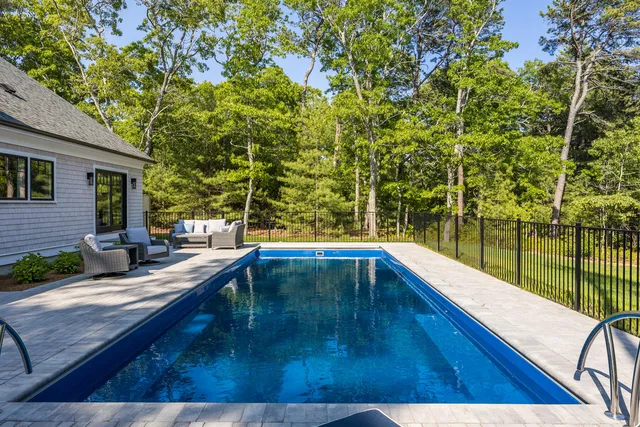 a view of swimming pool with a patio