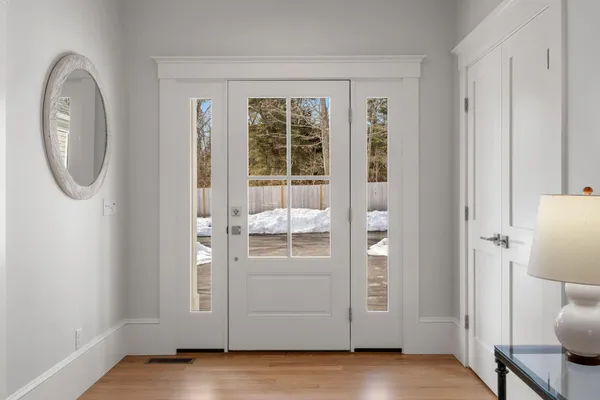 a kitchen with granite countertop stainless steel appliances a refrigerator and a dining table