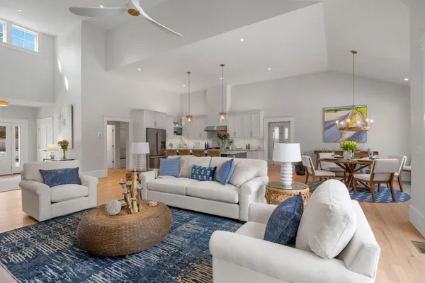 a kitchen with white cabinets and appliances