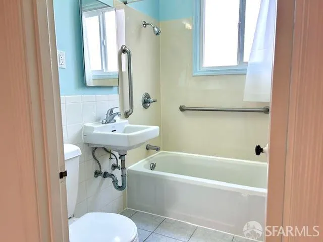 a bathroom with a sink toilet and tub