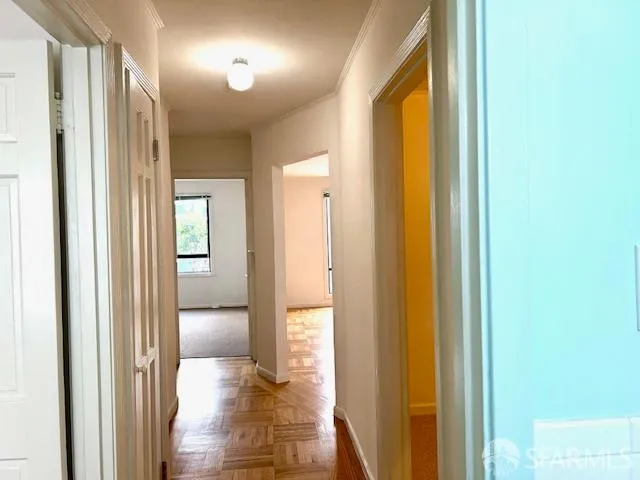 a view of a bathroom from a hallway