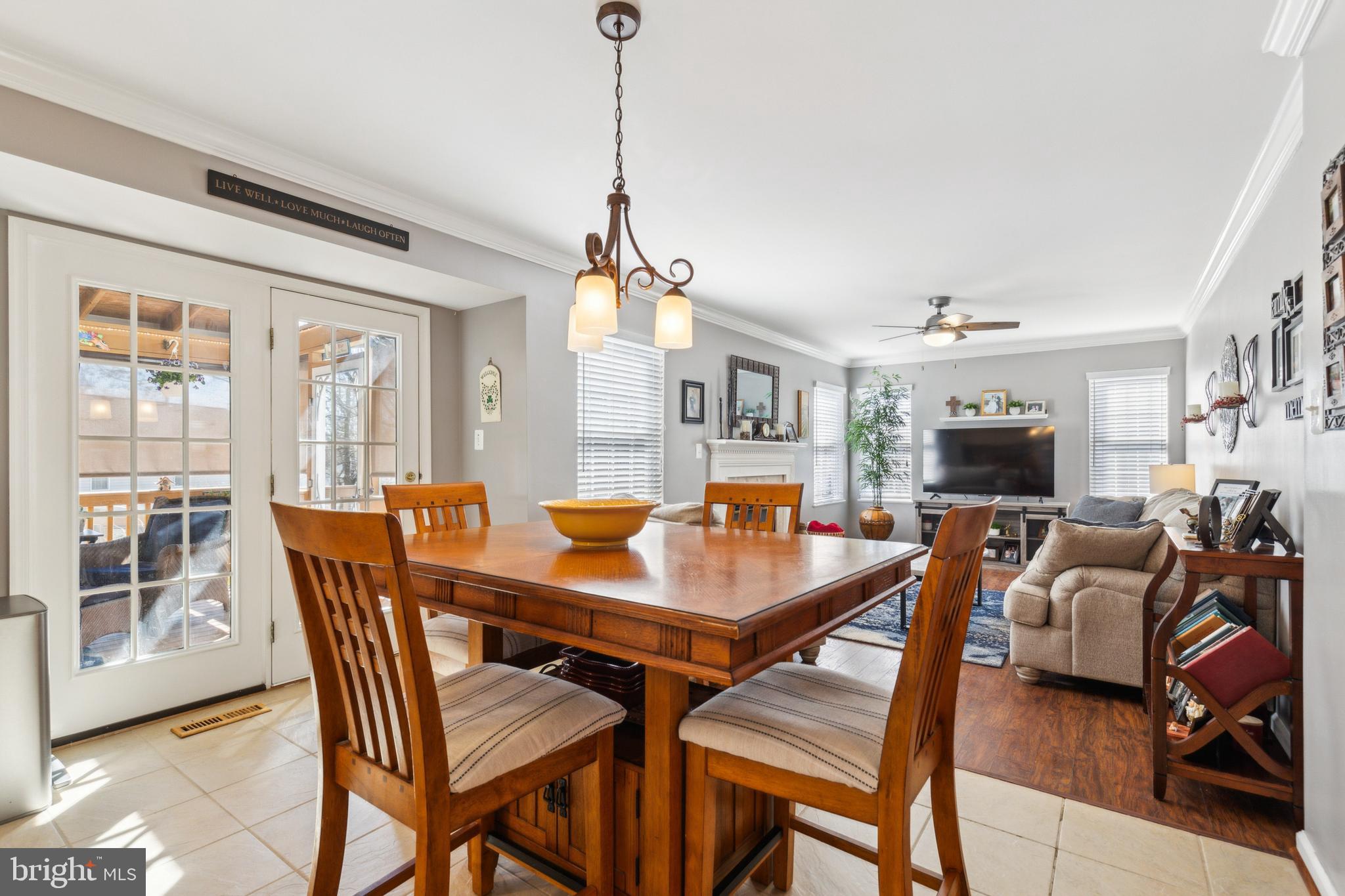 20752 Cross Timber Drive Ashburn, VA 20147 - Photo 17 of 39 a dining room with furniture window and wooden floor