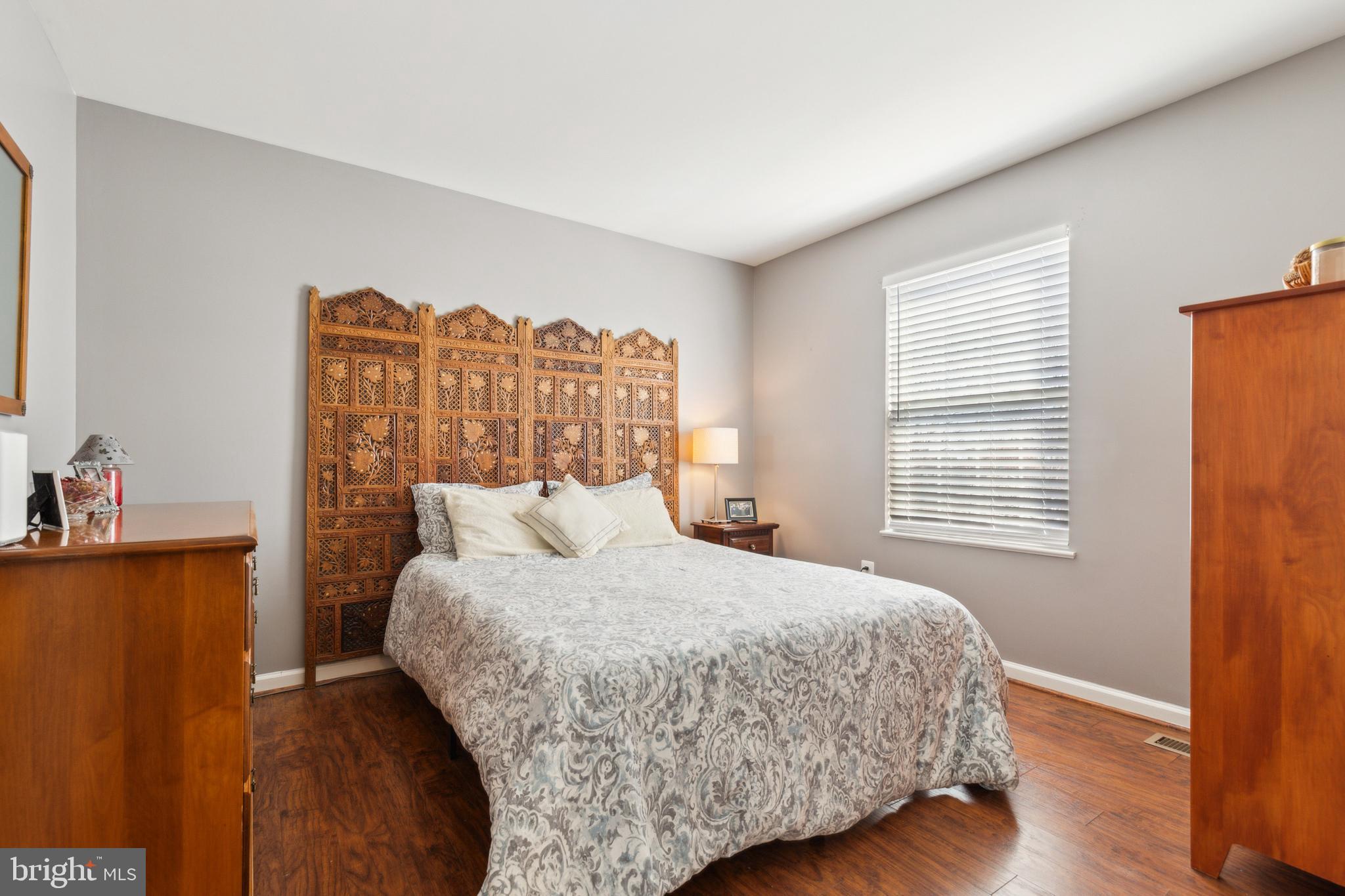 20752 Cross Timber Drive Ashburn, VA 20147 - Photo 29 of 39 a bedroom with a bed and a table in it
