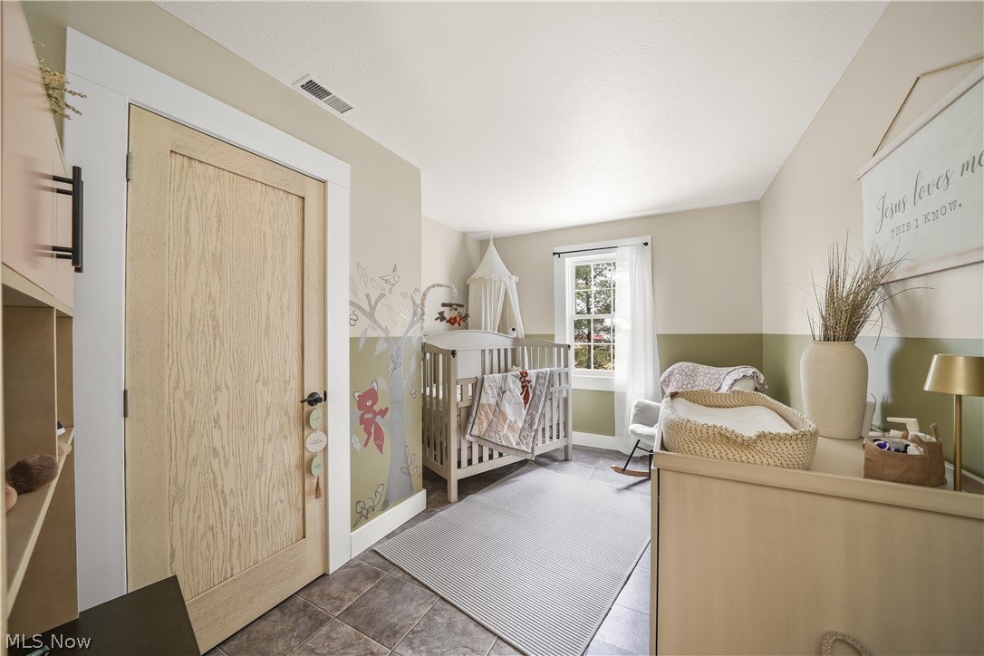 9561 Creaser Road North Bloomfield, OH 44450 - Photo 14 of 45 Bedroom with a nursery area and a closet
