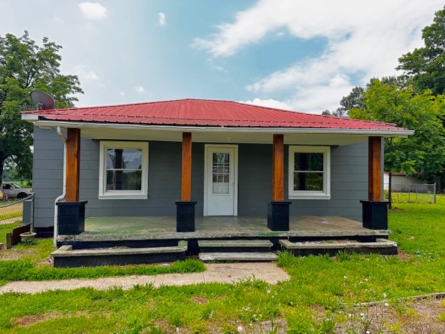 a view of house with backyard