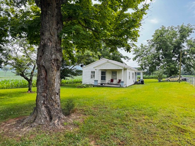 2160 Francisco Road Huntland, TN 37345 - Photo 2 of 21 a front view of a house with garden
