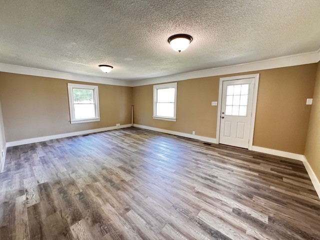 2160 Francisco Road Huntland, TN 37345 - Photo 4 of 21 an empty room with wooden floor and windows