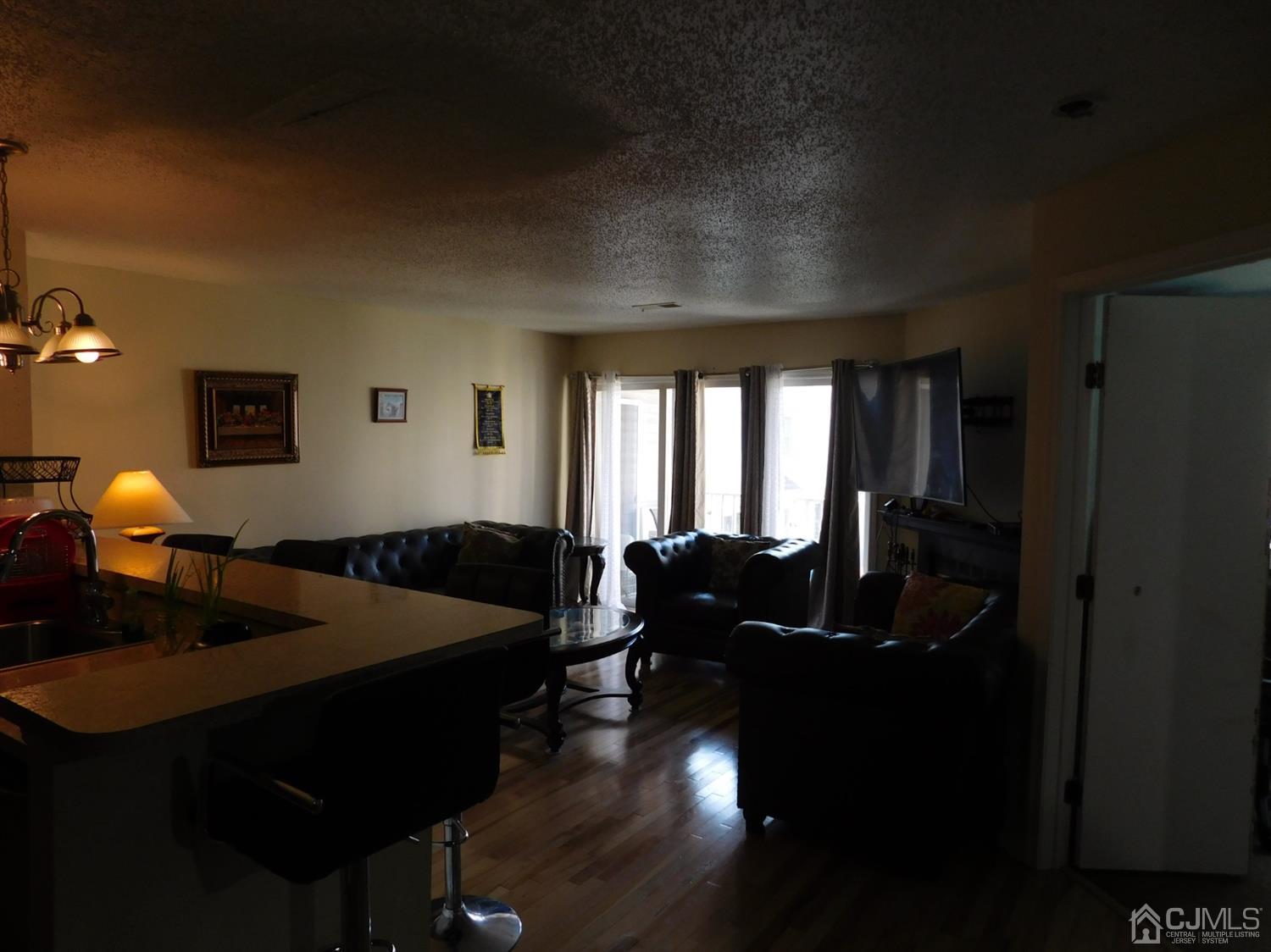 723 Edpas Road New Brunswick, NJ 08901 - Photo 1 of 20 a bedroom with bed and window with chair