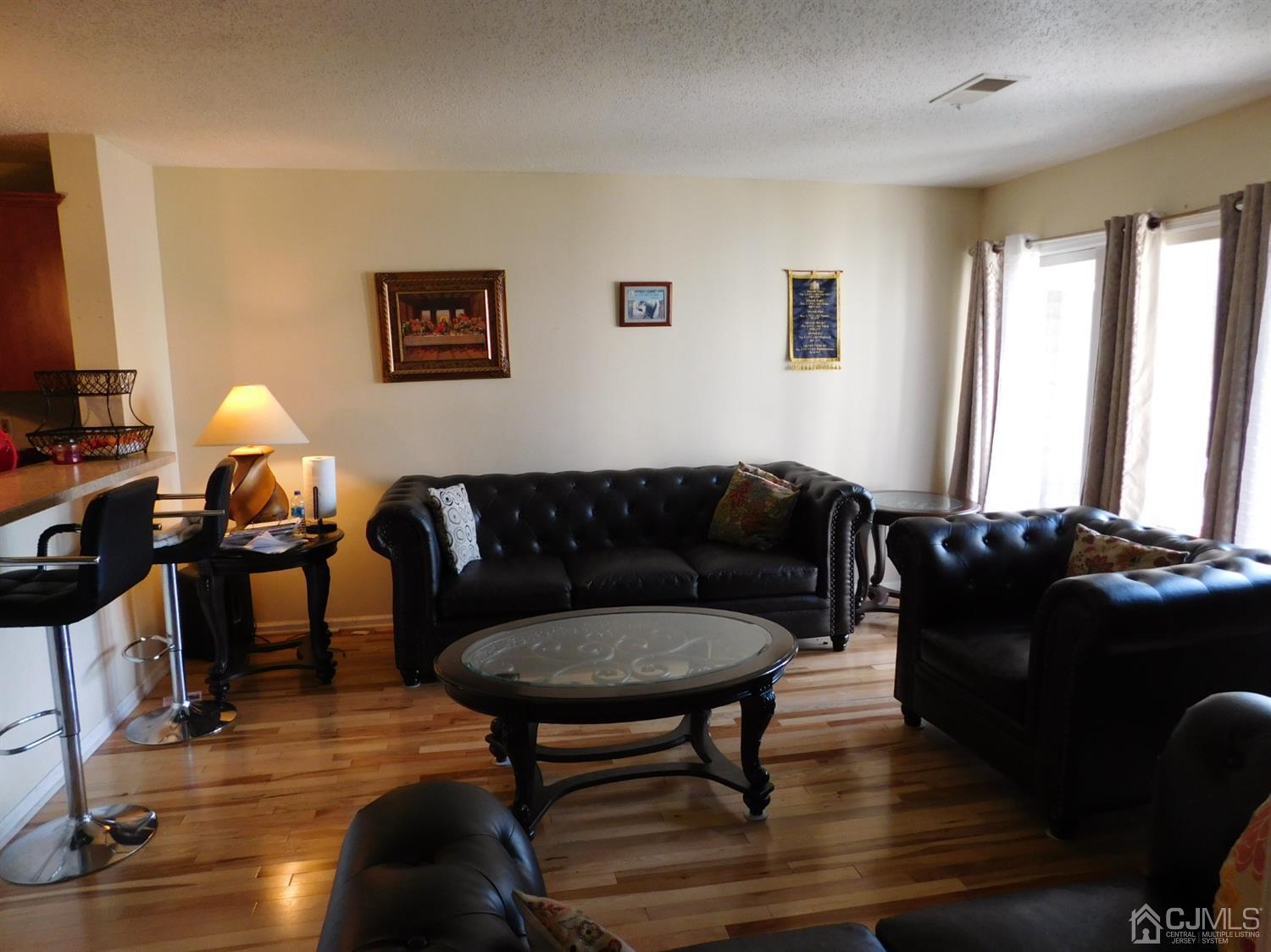 723 Edpas Road New Brunswick, NJ 08901 - Photo 13 of 20 a living room with furniture and a flat screen tv