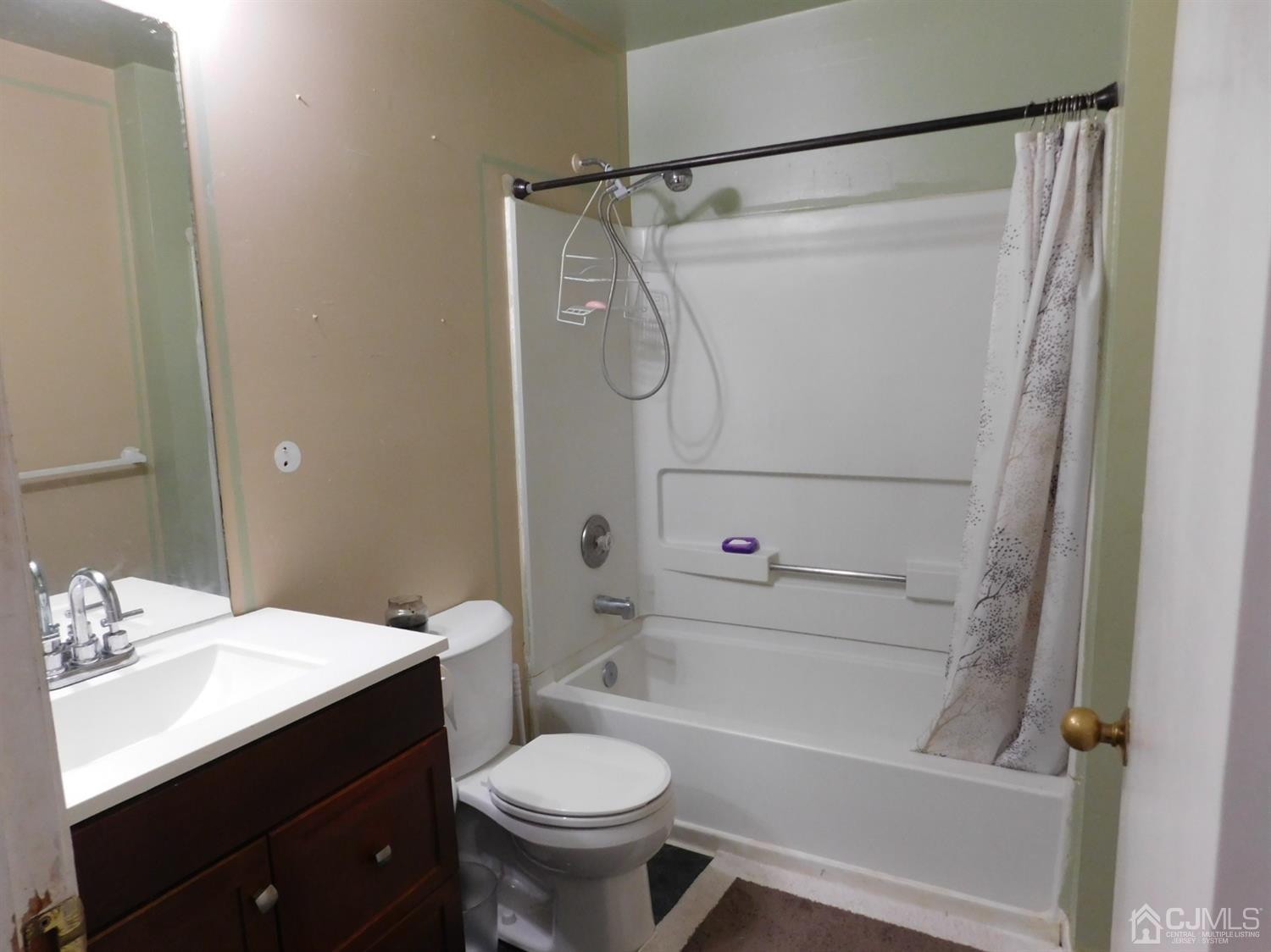 723 Edpas Road New Brunswick, NJ 08901 - Photo 14 of 20 a bathroom with a sink a toilet and shower