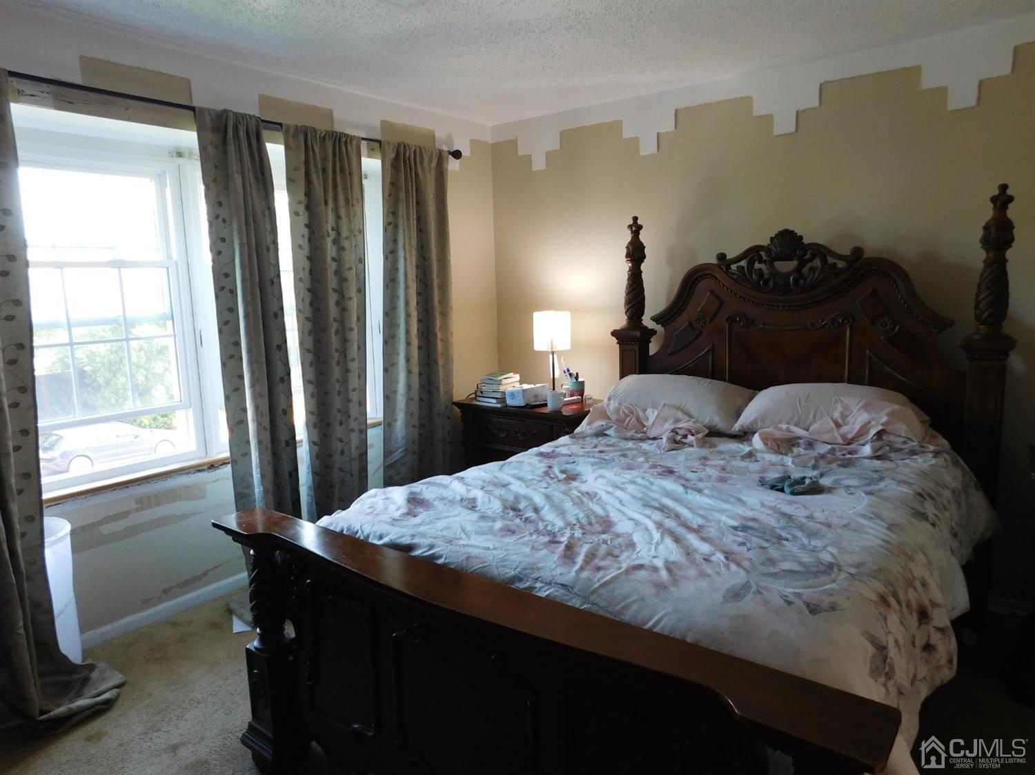 723 Edpas Road New Brunswick, NJ 08901 - Photo 19 of 20 a bedroom with a bed and a window