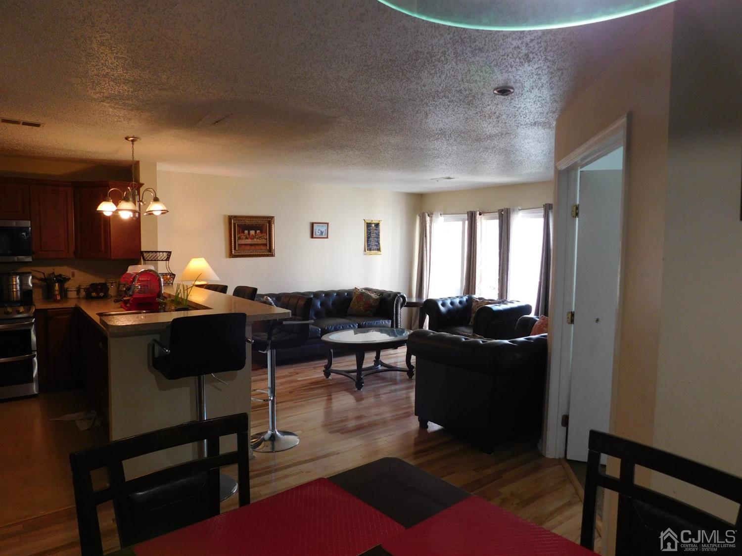 723 Edpas Road New Brunswick, NJ 08901 - Photo 4 of 20 a living room with furniture and a large window